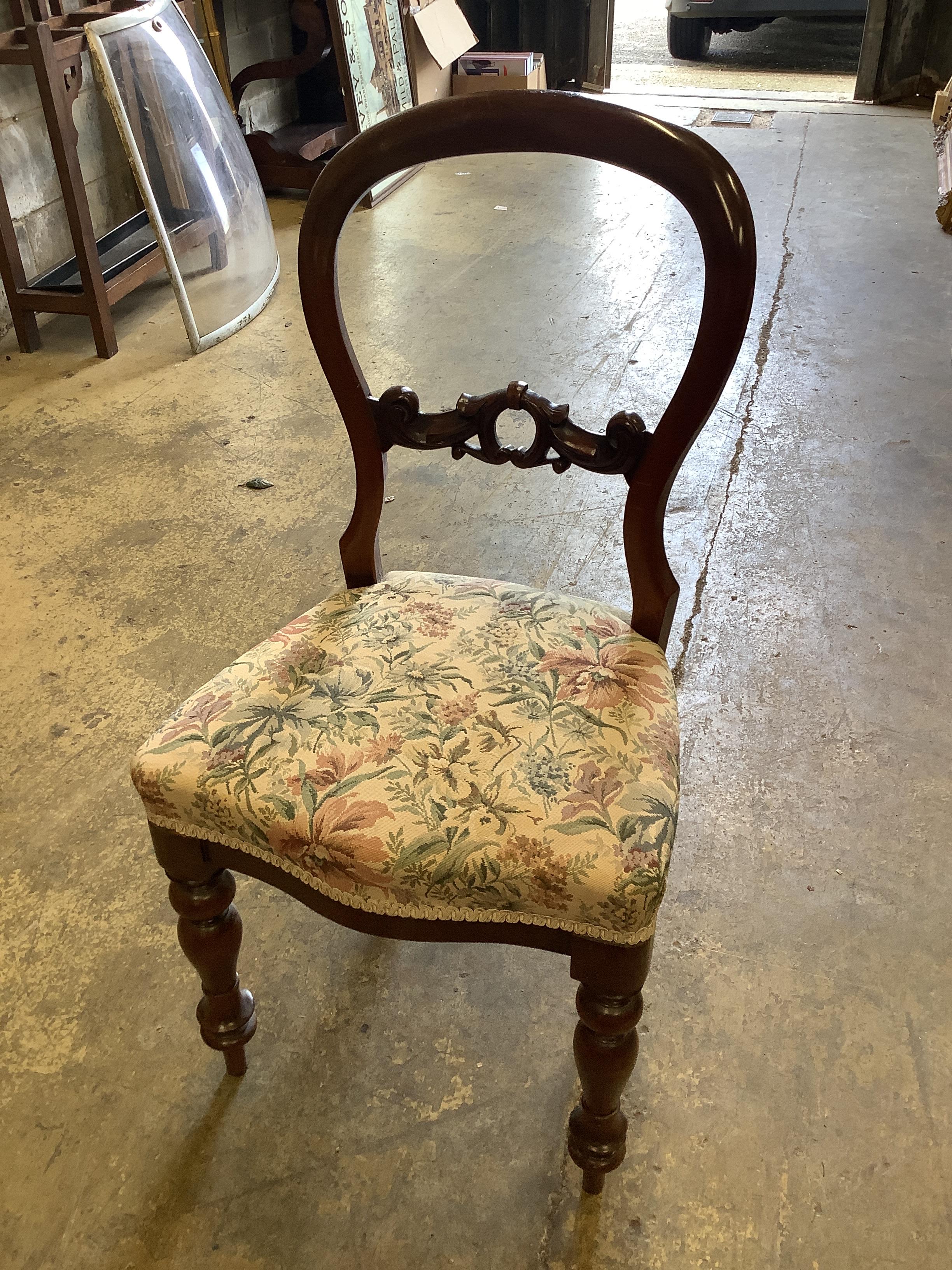 A harlequin set of six Victorian mahogany balloon back dining chairs